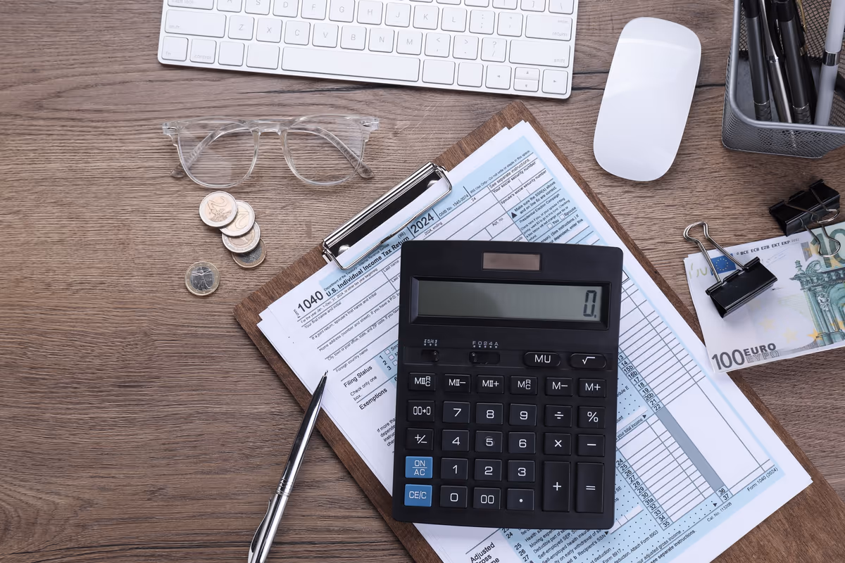 A tax form and a calculator on a desk