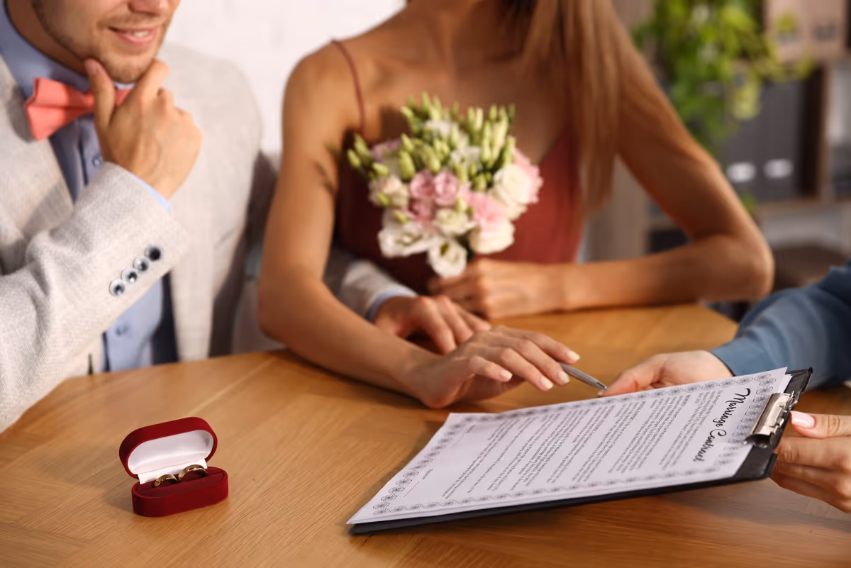 A bride-to-be with a contract and a ring box